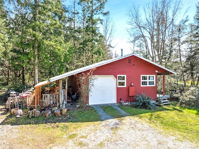 view of home's exterior with driveway and a garage