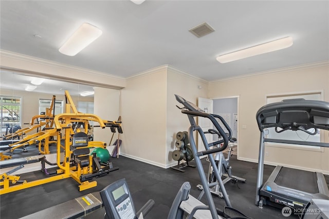 gym featuring visible vents, baseboards, and ornamental molding