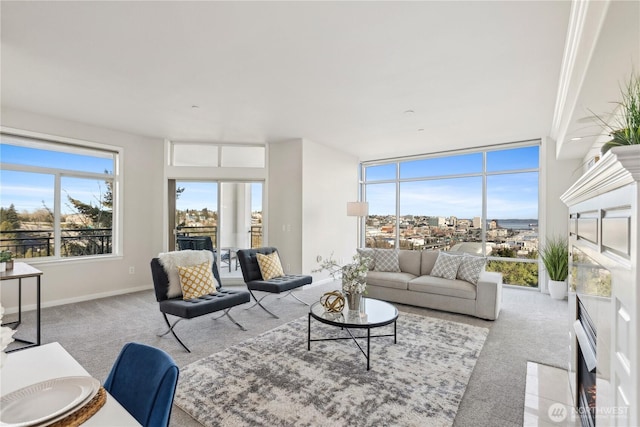 carpeted living room with baseboards