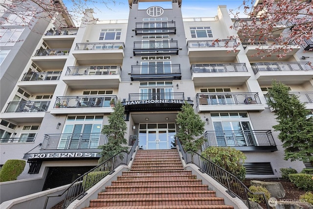 view of property featuring stairs