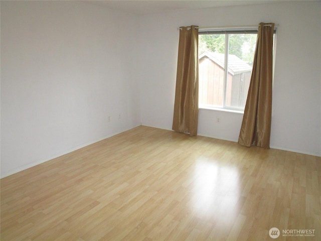 spare room with light wood-style flooring