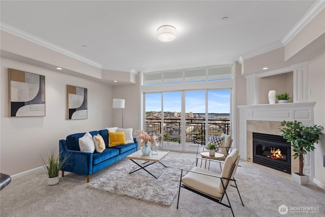 carpeted living area featuring a mountain view, ornamental molding, baseboards, and a tile fireplace
