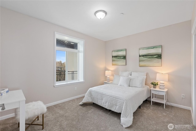 carpeted bedroom featuring baseboards