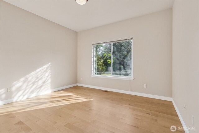 6719 Prairie Ridge Dr NE, Olympia, WA 98516 - spare room featuring light wood-style floors and baseboards
