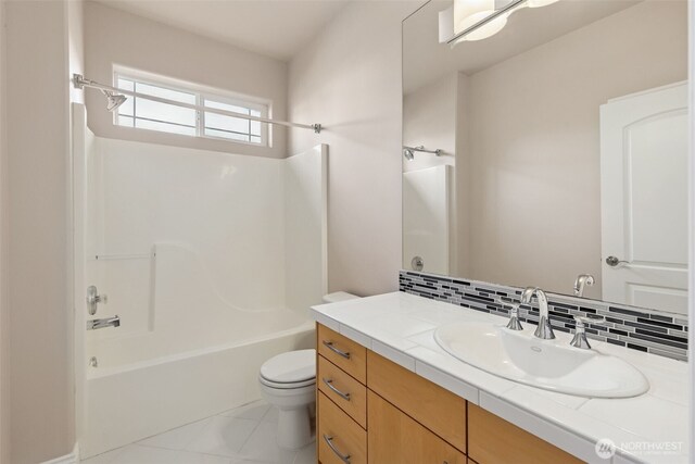 6719 Prairie Ridge Dr NE, Olympia, WA 98516 - bathroom with vanity, bathing tub / shower combination, toilet, and backsplash