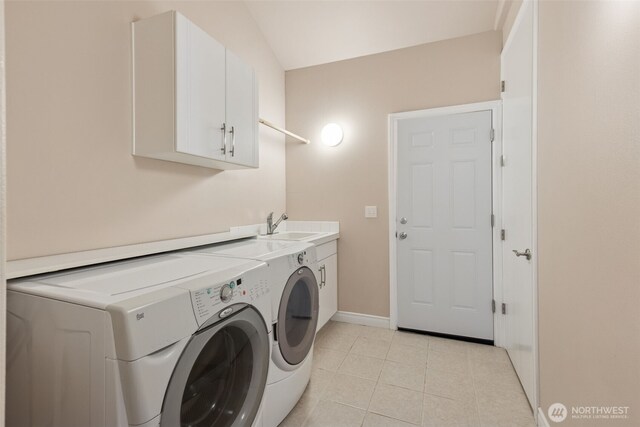 6719 Prairie Ridge Dr NE, Olympia, WA 98516 - clothes washing area featuring baseboards, light tile patterned flooring, cabinet space, a sink, and washer and clothes dryer