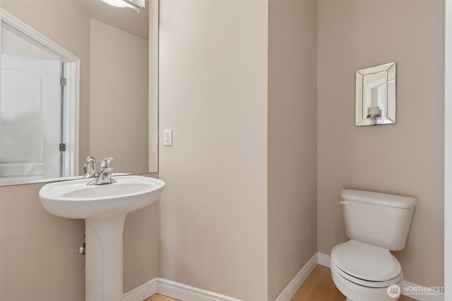 6719 Prairie Ridge Dr NE, Olympia, WA 98516 - bathroom with baseboards and toilet