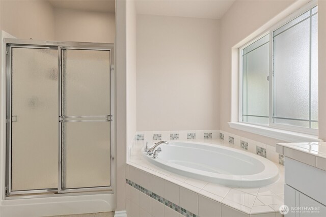 6719 Prairie Ridge Dr NE, Olympia, WA 98516 - bathroom featuring a shower stall, vanity, and a garden tub