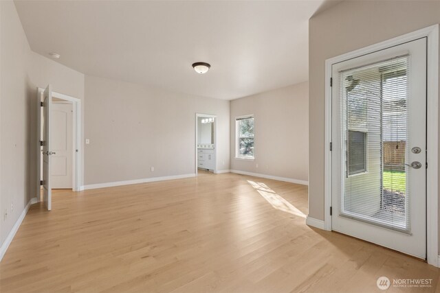 6719 Prairie Ridge Dr NE, Olympia, WA 98516 - spare room featuring light wood-type flooring and baseboards