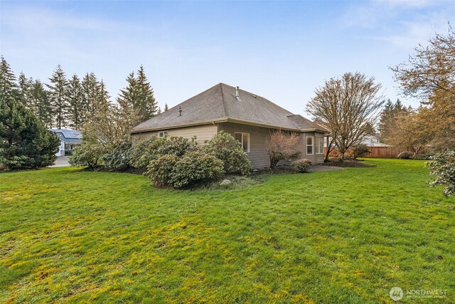 6719 Prairie Ridge Dr NE, Olympia, WA 98516 - rear view of house with a lawn and fence