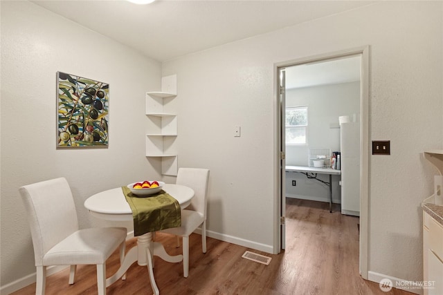 3348 SW Christmas Tree Ln, Port Orchard, WA 98367 - dining area with wood finished floors and baseboards