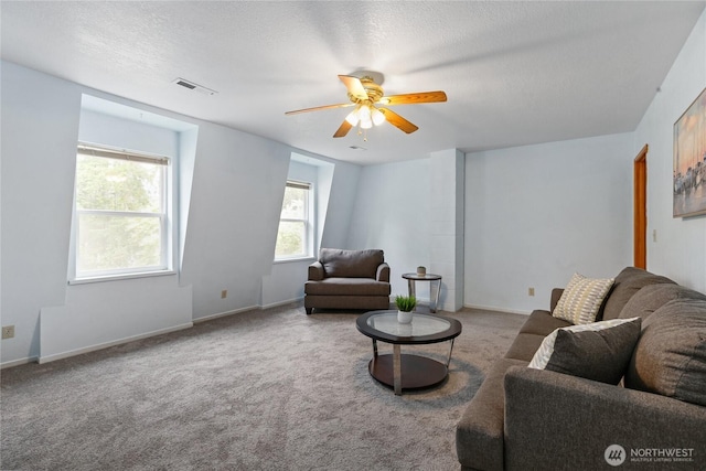 3348 SW Christmas Tree Ln, Port Orchard, WA 98367 - carpeted living area featuring a ceiling fan, healthy amount of natural light, and a textured ceiling