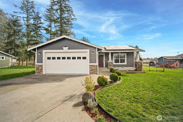 6473 Trigg Woods Ln, Ferndale, WA 98248 - view of front of property with solar panels, a front yard, concrete driveway, and an attached garage