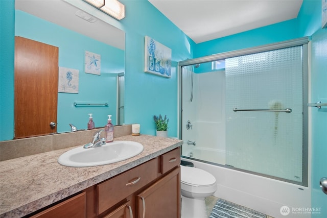 6473 Trigg Woods Ln, Ferndale, WA 98248 - bathroom with combined bath / shower with glass door, toilet, and vanity