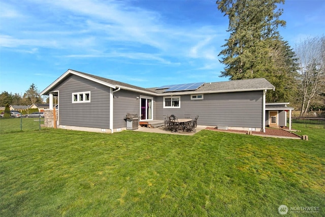 6473 Trigg Woods Ln, Ferndale, WA 98248 - back of property featuring roof mounted solar panels, a yard, and fence