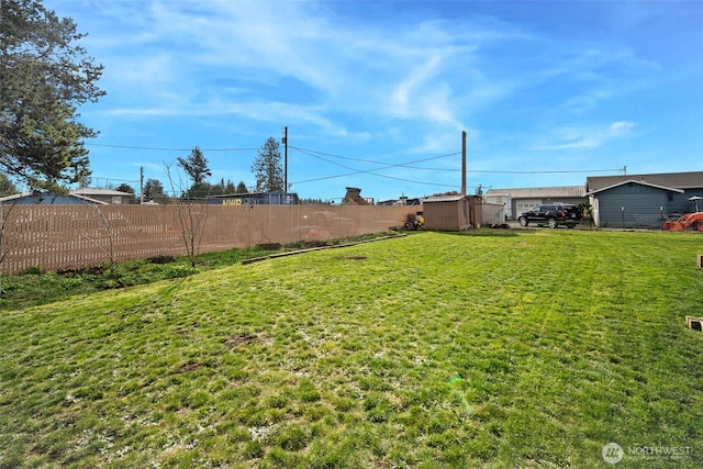 6473 Trigg Woods Ln, Ferndale, WA 98248 - view of yard with a storage shed, an outdoor structure, and fence