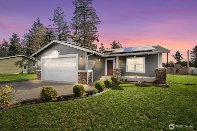 6473 Trigg Woods Ln, Ferndale, WA 98248 - view of front of house with solar panels, concrete driveway, a garage, and a front lawn