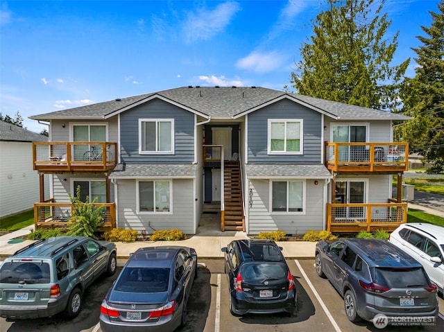 20107 Blair Ln, Rochester, WA 98579 - townhome / multi-family property with stairway, a shingled roof, and uncovered parking