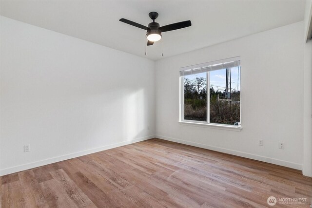 20107 Blair Ln, Rochester, WA 98579 - empty room with ceiling fan, baseboards, and wood finished floors