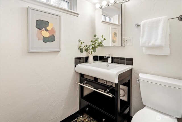 bathroom with a sink and toilet
