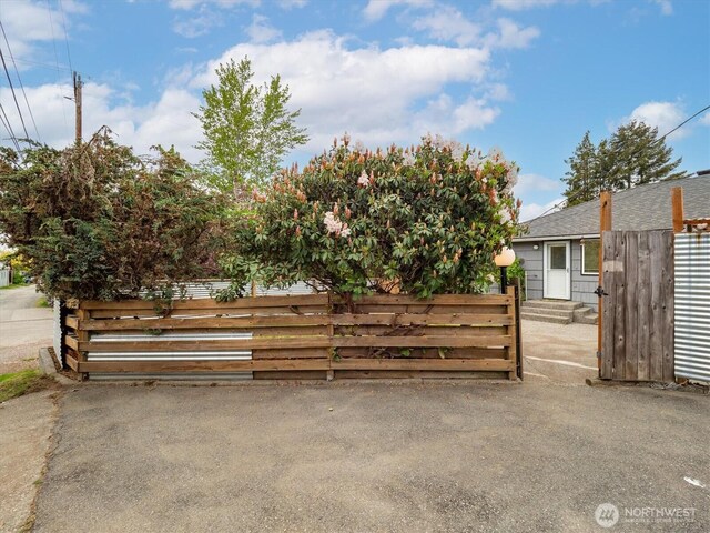 view of gate with fence