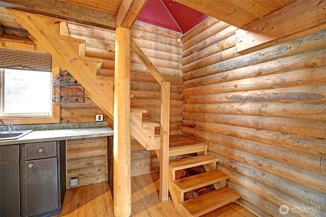 stairway featuring hardwood / wood-style floors