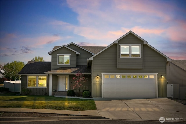 view of front of house featuring fence, a front yard, roof with shingles, an attached garage, and driveway