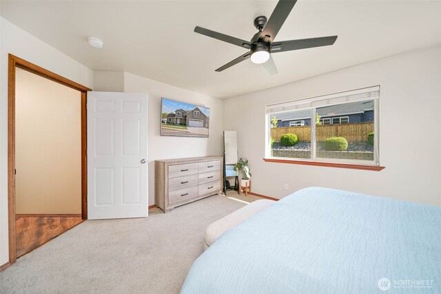 bedroom featuring baseboards, carpet flooring, and ceiling fan
