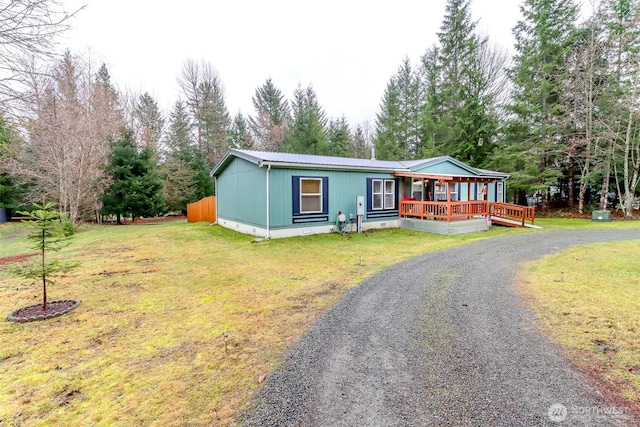 440 Cannon Rd, Packwood, WA 98361 - view of front of house with driveway, metal roof, crawl space, and a front yard