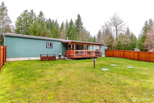 440 Cannon Rd, Packwood, WA 98361 - rear view of property with a fenced backyard, a lawn, a deck, and metal roof