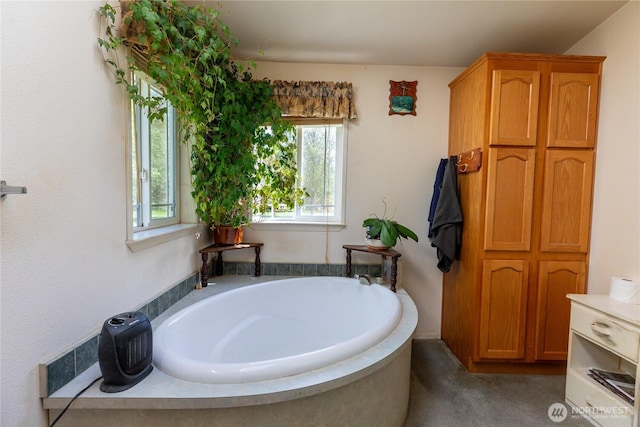 bathroom with a garden tub