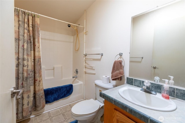 bathroom featuring toilet, vanity, and shower / bath combination with curtain