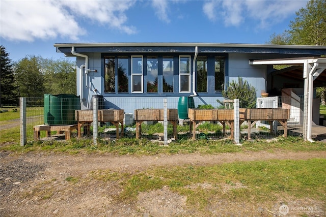 back of house with central AC