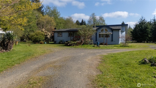view of front of home with a front lawn and driveway