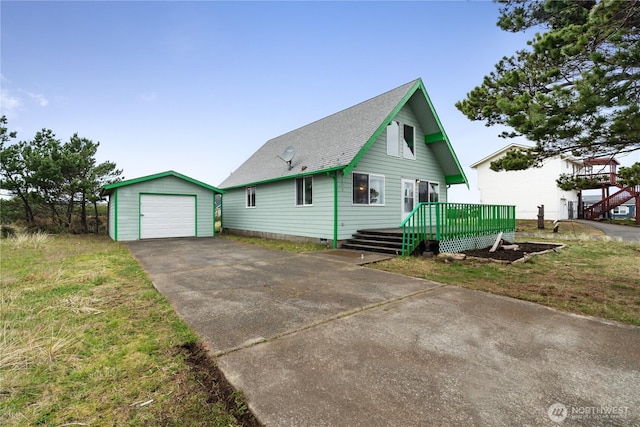 1205 Fairwood Dr SW, Ocean Shores, WA 98569 - view of front of property featuring an outbuilding, driveway, a wooden deck, a shingled roof, and a garage