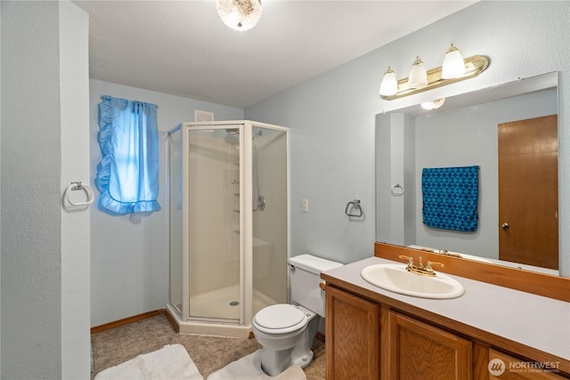 1205 Fairwood Dr SW, Ocean Shores, WA 98569 - full bathroom featuring vanity, a shower stall, and toilet