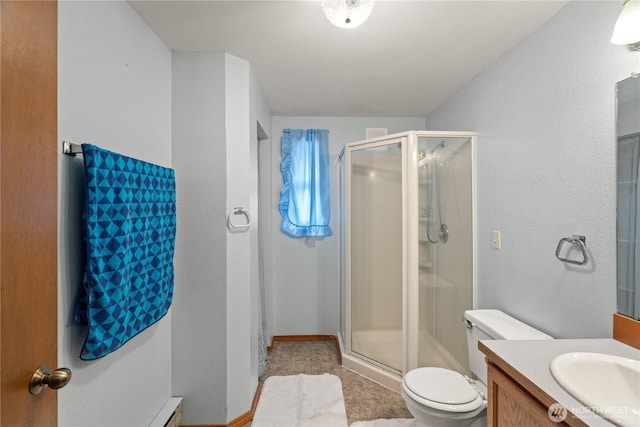 1205 Fairwood Dr SW, Ocean Shores, WA 98569 - full bath with tile patterned floors, toilet, a stall shower, and vanity