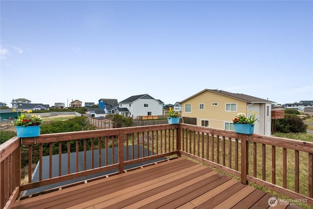 1205 Fairwood Dr SW, Ocean Shores, WA 98569 - wooden terrace featuring fence and a residential view