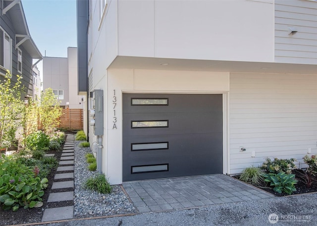 doorway to property featuring an attached garage