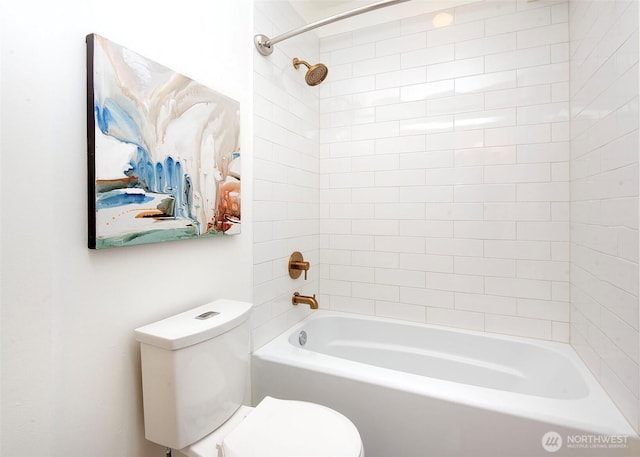 bathroom featuring toilet and tub / shower combination