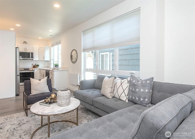 living room featuring recessed lighting and wood finished floors