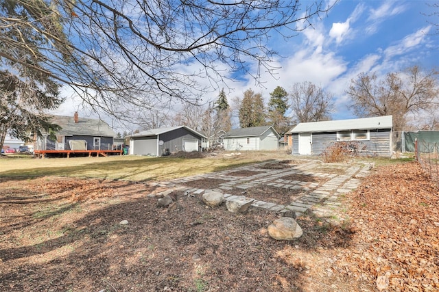 view of yard with an outbuilding and a wooden deck