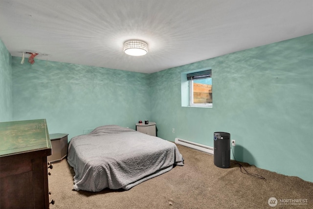 bedroom with a baseboard radiator and carpet flooring