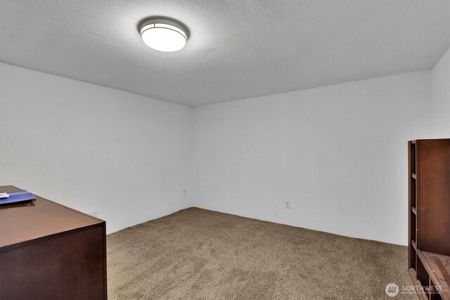interior space featuring a textured ceiling