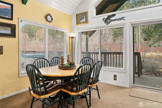 1081 Wapiti Dr, Cle Elum, WA 98922 - carpeted dining space with lofted ceiling and baseboards