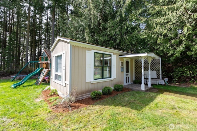 view of outbuilding with a playground