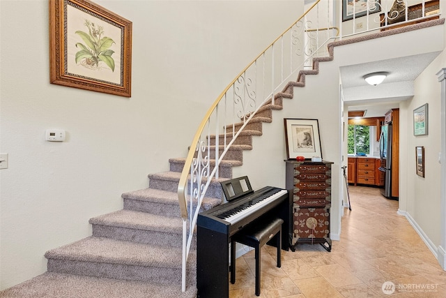 2913 SE Forest Villa Ct, Port Orchard, WA 98366 - stairway featuring stone tile floors and baseboards
