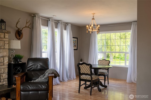 4200 N Pl, Seaview, WA 98644 - dining room featuring a chandelier and light wood-style flooring
