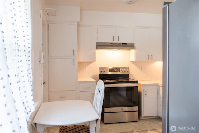 4200 N Pl, Seaview, WA 98644 - kitchen featuring appliances with stainless steel finishes, under cabinet range hood, light countertops, and white cabinetry