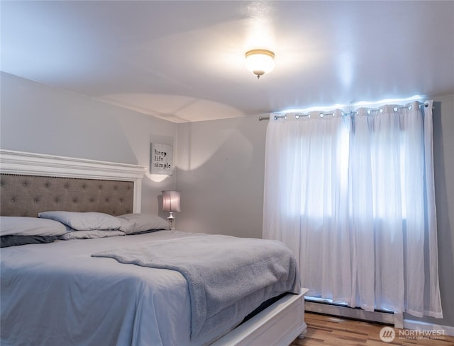 4200 N Pl, Seaview, WA 98644 - bedroom featuring a baseboard radiator and light wood finished floors